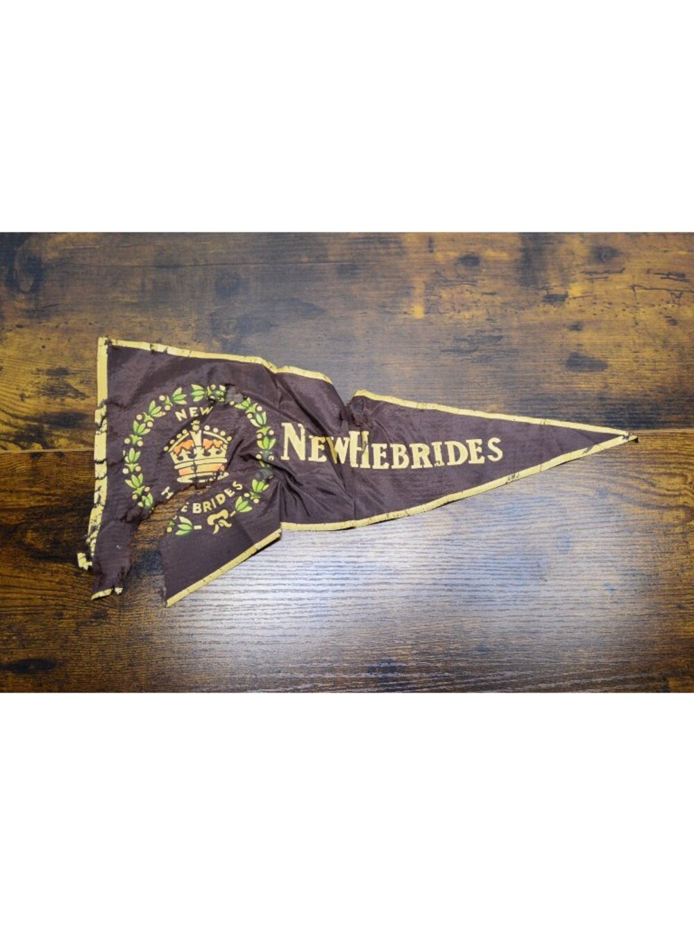 Vintage New Hebrides pennant heavily damaged